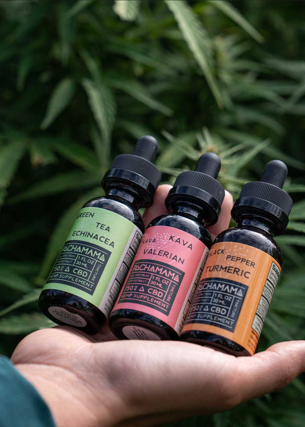 pachamama-hand-and-bottles